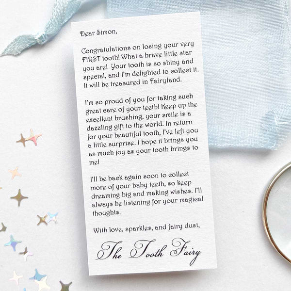 Miniature blue letter from the tooth fairy with child’s name