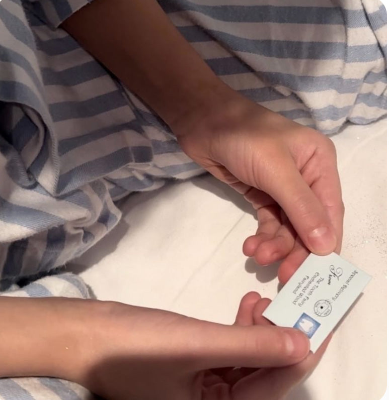 Magical blue tooth fairy message with tiny envelope