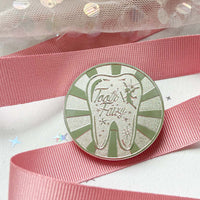 Close-up of silver tooth fairy coin, magical children’s keepsake